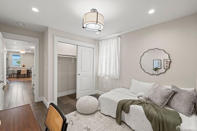 74 Crane St, San Francisco, CA 94124 - bedroom with a closet, wood finished floors, recessed lighting, and baseboards