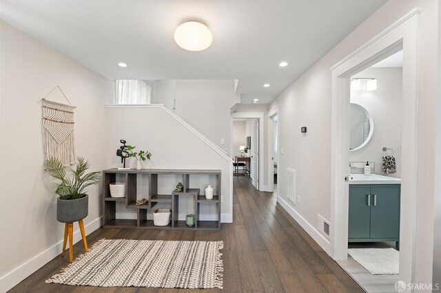 74 Crane St, San Francisco, CA 94124 - entryway featuring dark wood-type flooring, stairway, recessed lighting, and baseboards