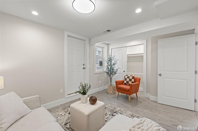 74 Crane St, San Francisco, CA 94124 - living area featuring baseboards, light wood-type flooring, and recessed lighting