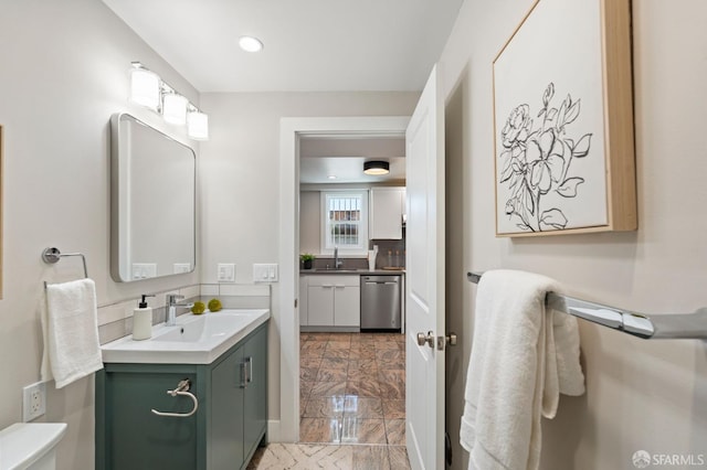 74 Crane St, San Francisco, CA 94124 - bathroom featuring marble finish floors, vanity, toilet, and recessed lighting