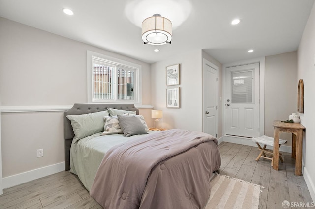 74 Crane St, San Francisco, CA 94124 - bedroom with light wood finished floors, baseboards, and recessed lighting