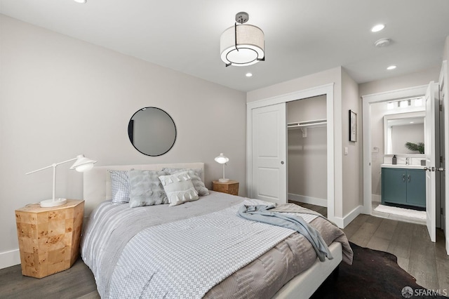74 Crane St, San Francisco, CA 94124 - bedroom featuring dark wood finished floors, baseboards, a closet, recessed lighting, and a sink
