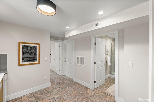 74 Crane St, San Francisco, CA 94124 - corridor featuring baseboards, recessed lighting, and light stone finish floors