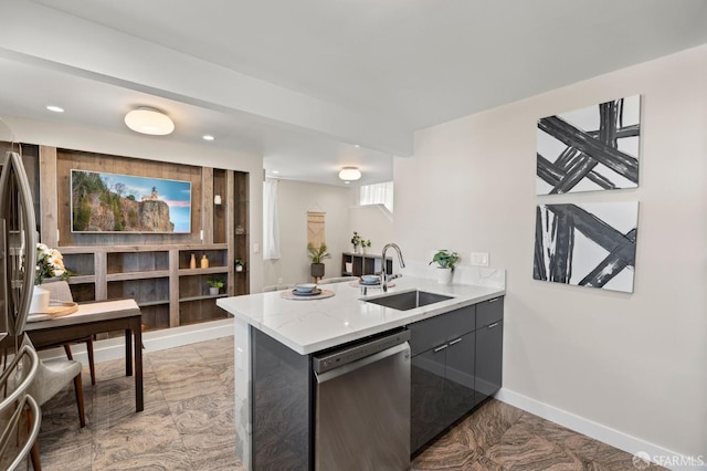 74 Crane St, San Francisco, CA 94124 - kitchen featuring appliances with stainless steel finishes, a sink, a peninsula, baseboards, and light stone counters