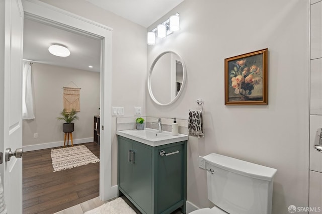 74 Crane St, San Francisco, CA 94124 - bathroom with vanity, wood finished floors, toilet, and baseboards