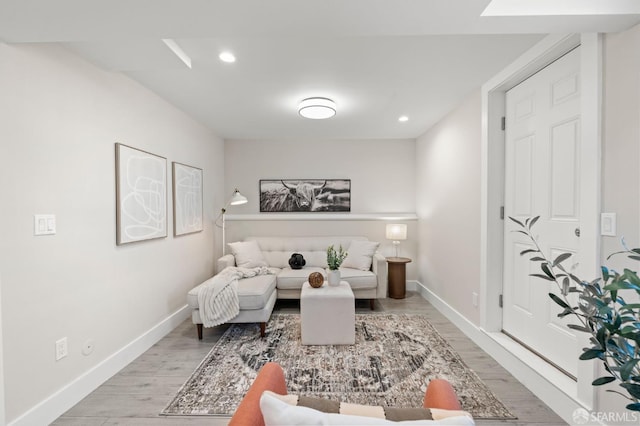 74 Crane St, San Francisco, CA 94124 - living room featuring light wood-style flooring, baseboards, and recessed lighting