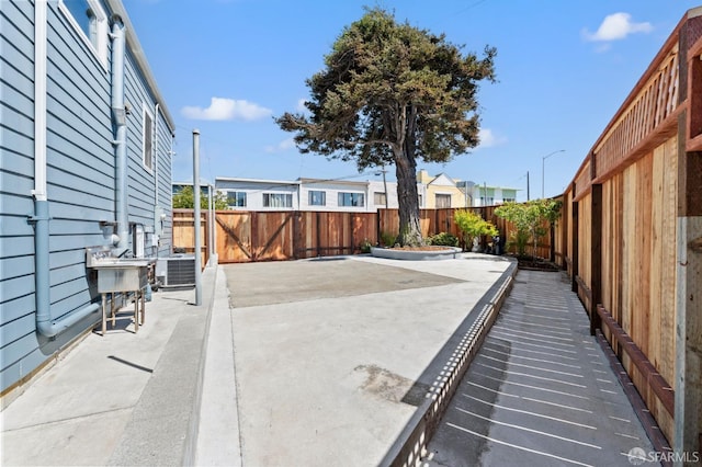 74 Crane St, San Francisco, CA 94124 - fenced backyard with a patio and cooling unit