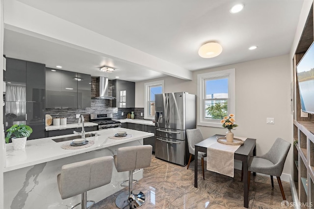 74 Crane St, San Francisco, CA 94124 - kitchen featuring stainless steel appliances, wall chimney exhaust hood, a sink, modern cabinets, and tasteful backsplash