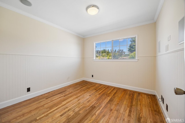 2033 Oakmont Dr, San Bruno, CA 94066 - unfurnished room featuring light wood-style flooring, a wainscoted wall, baseboards, and ornamental molding