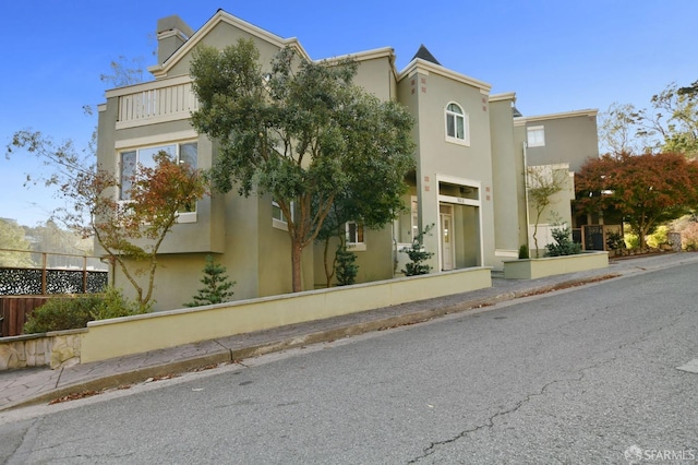 view of home's exterior with a balcony