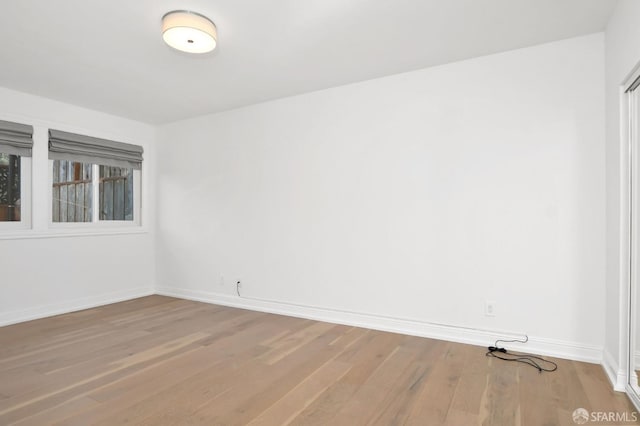 spare room featuring hardwood / wood-style floors