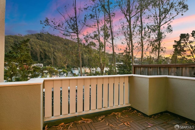 view of balcony at dusk