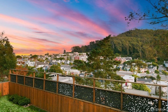 view of balcony at dusk