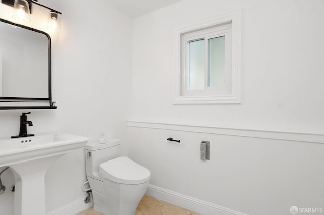 bathroom with tile patterned floors and toilet