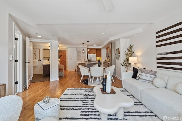 living room with light hardwood / wood-style floors