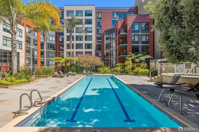 view of pool featuring a patio area