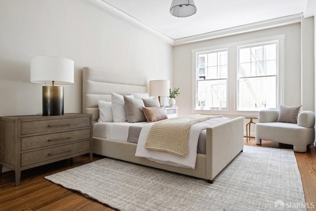 bedroom with wood finished floors