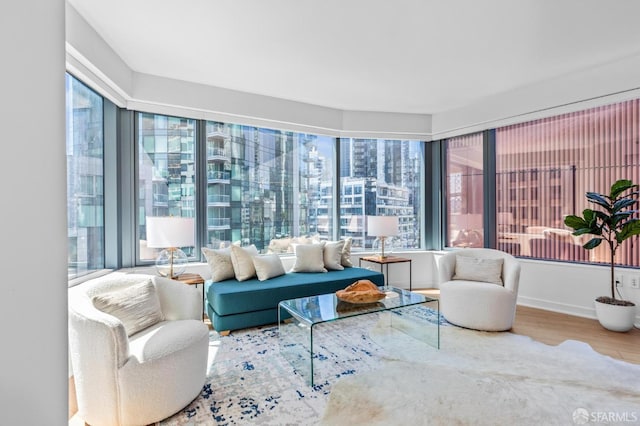 sunroom / solarium featuring a city view