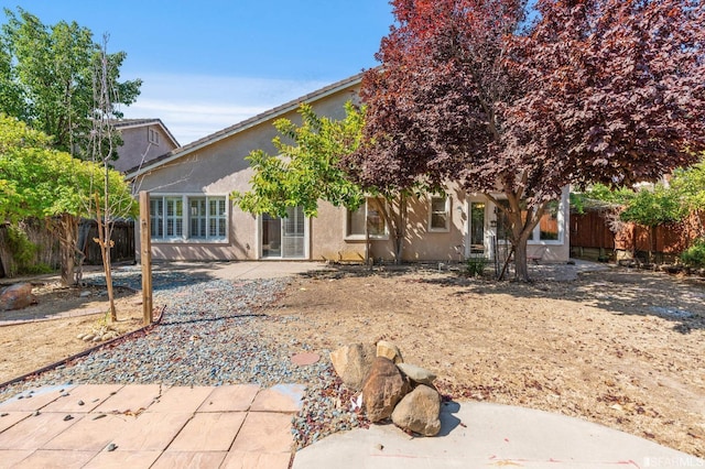 rear view of house featuring a patio