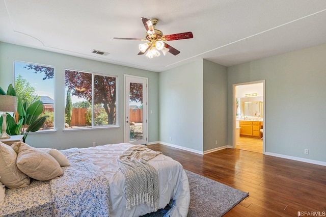 bedroom featuring ceiling fan, connected bathroom, hardwood / wood-style floors, and access to outside