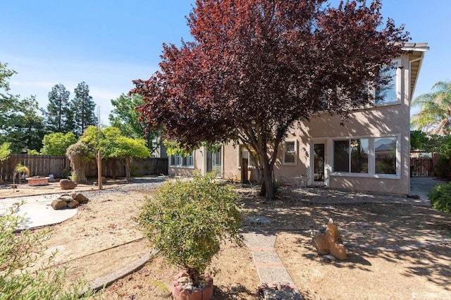 view of front facade with an outdoor fire pit