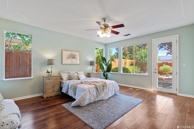 bedroom with ceiling fan, dark hardwood / wood-style flooring, and access to outside