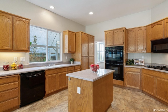 kitchen with a kitchen island, sink, a wealth of natural light, and black appliances