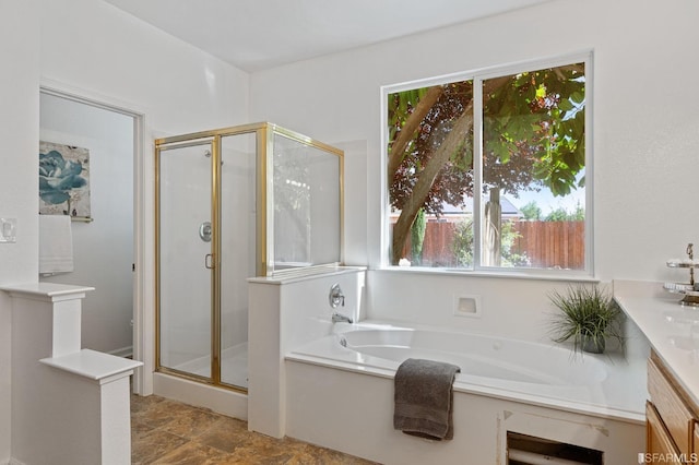 bathroom featuring vanity and plus walk in shower