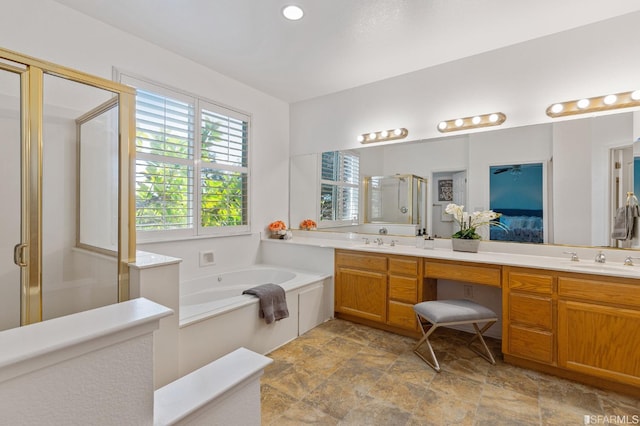 bathroom featuring vanity and separate shower and tub