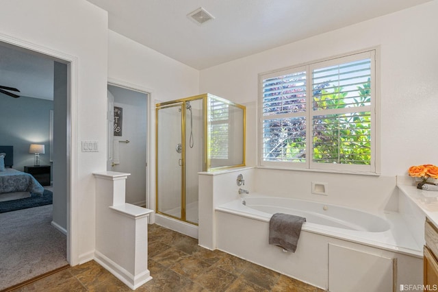 bathroom with separate shower and tub