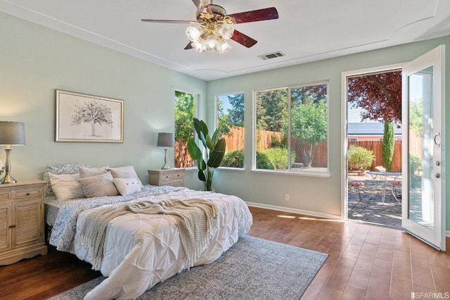 bedroom featuring hardwood / wood-style flooring, access to exterior, and ceiling fan