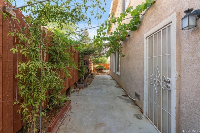 view of side of home featuring a patio area