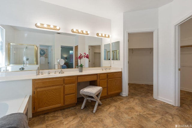 bathroom featuring plus walk in shower and vanity