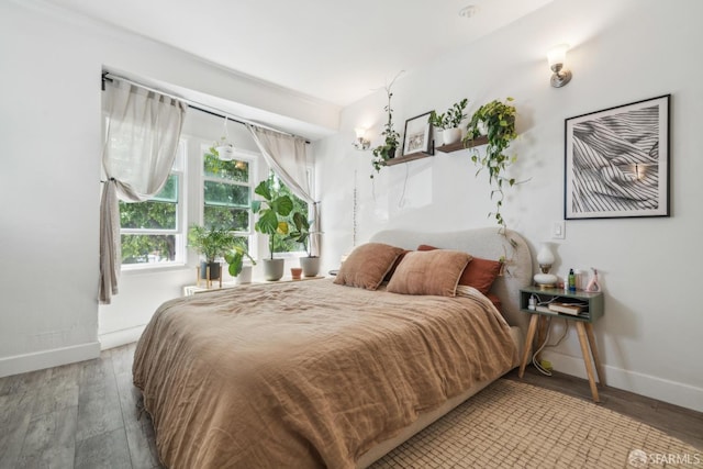 488 41st St, Oakland, CA 94609 - bedroom featuring baseboards and wood finished floors
