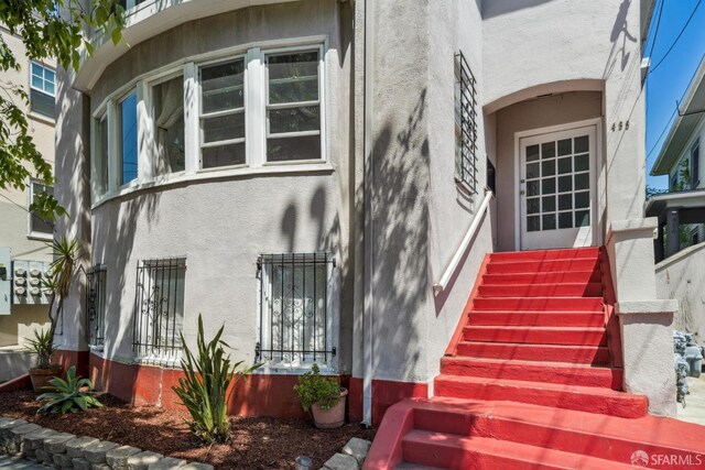 488 41st St, Oakland, CA 94609 - property entrance featuring stucco siding