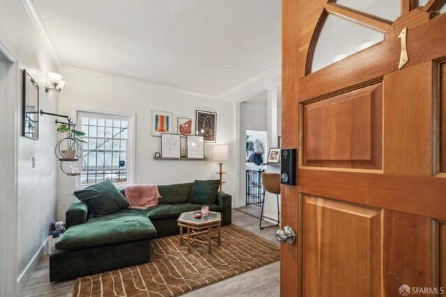 488 41st St, Oakland, CA 94609 - living room featuring wood finished floors and crown molding