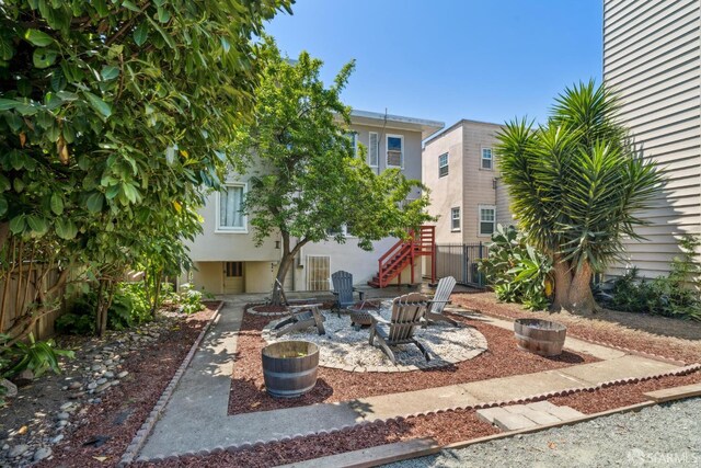 488 41st St, Oakland, CA 94609 - view of patio featuring stairway and a fire pit
