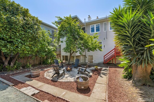 488 41st St, Oakland, CA 94609 - view of patio with stairway and a fire pit