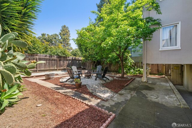 488 41st St, Oakland, CA 94609 - fenced backyard featuring a patio area and a fire pit