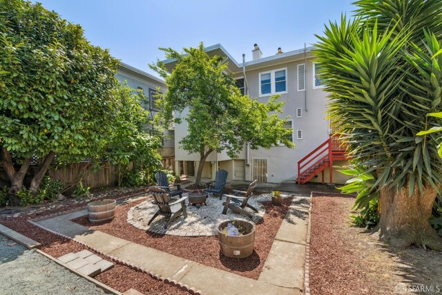 488 41st St, Oakland, CA 94609 - view of patio featuring a fire pit and stairway