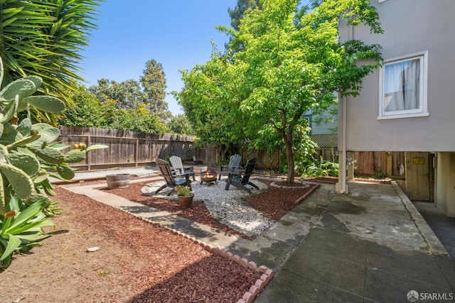 488 41st St, Oakland, CA 94609 - fenced backyard with a patio area and a fire pit