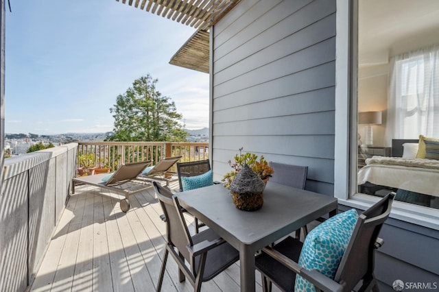 deck featuring outdoor dining area