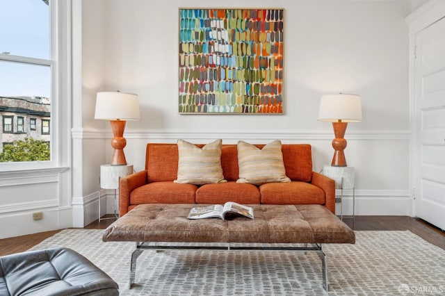 living room featuring baseboards and wood finished floors