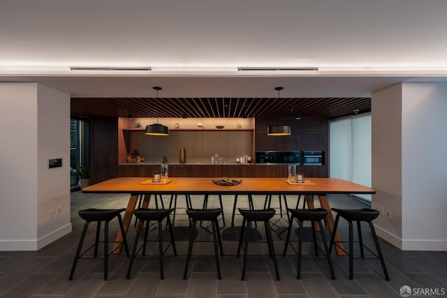 interior space with a breakfast bar area and oven