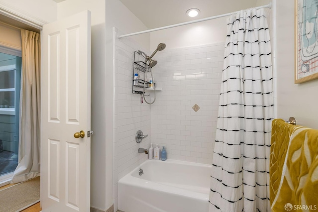 bathroom with shower / bath combination with curtain