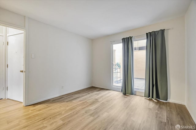 empty room with light wood-type flooring