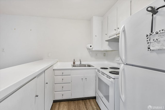 kitchen featuring sink, white appliances, white cabinetry, and dark hardwood / wood-style floors