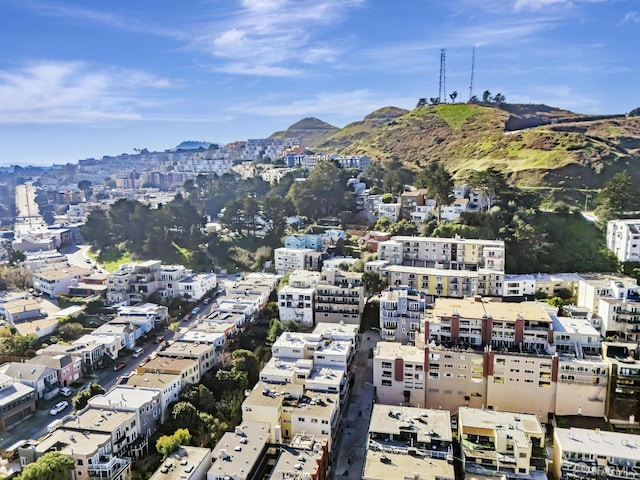 birds eye view of property with a mountain view