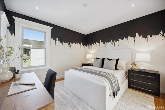 bedroom featuring light wood-type flooring and multiple windows