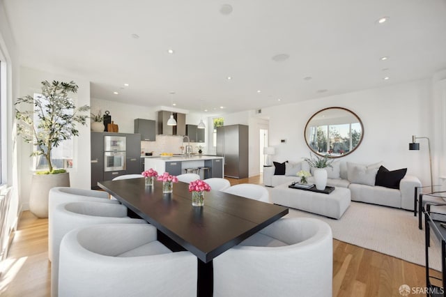 dining room with light wood-type flooring